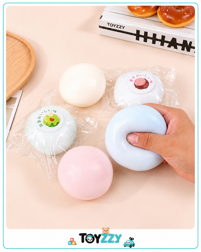 Toyzzy Mochi Squishy Toy squeezed with both hands showing soft texture
