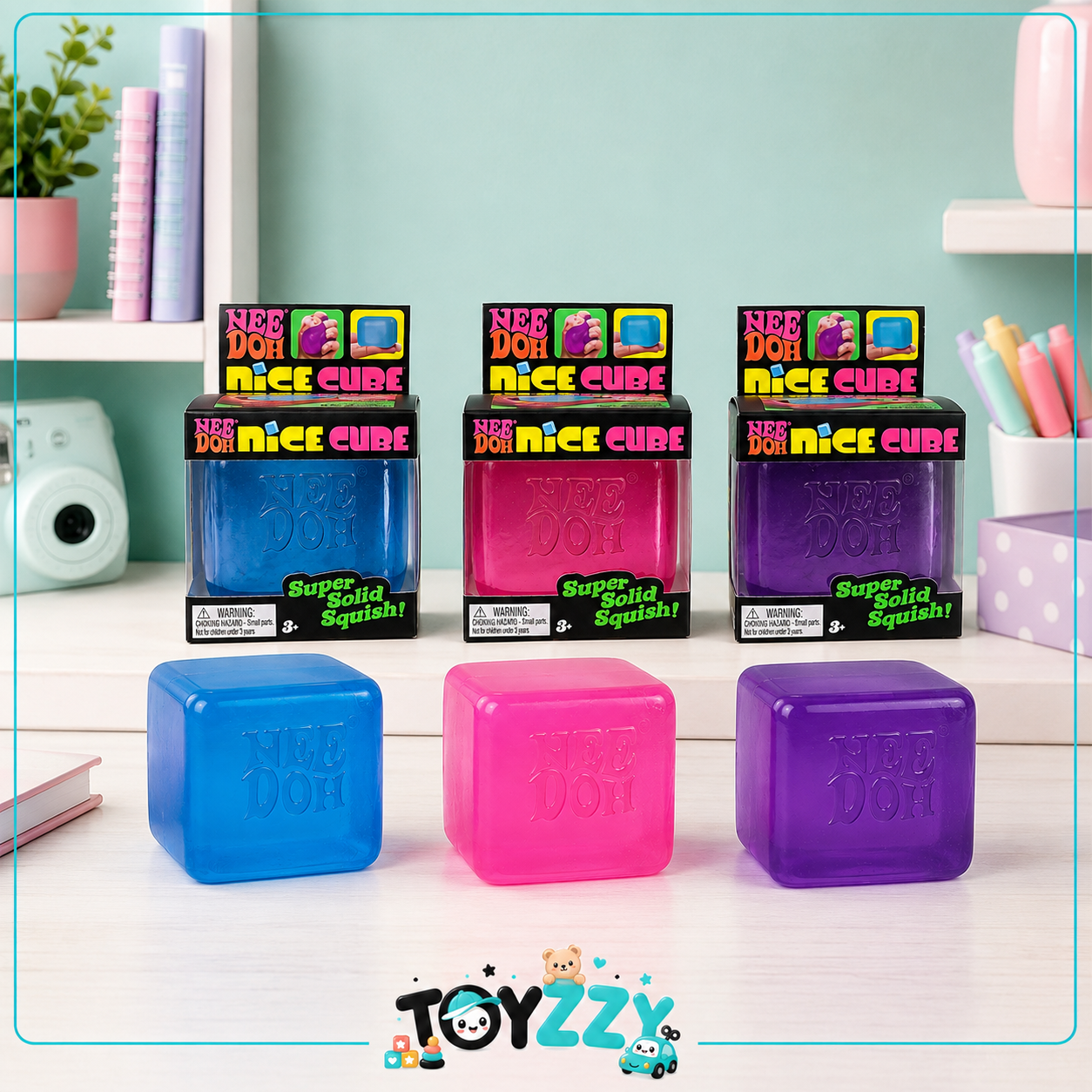 NeeDoh Nice Cube sensory toys in blue pink and purple lifestyle display - Toyzzy