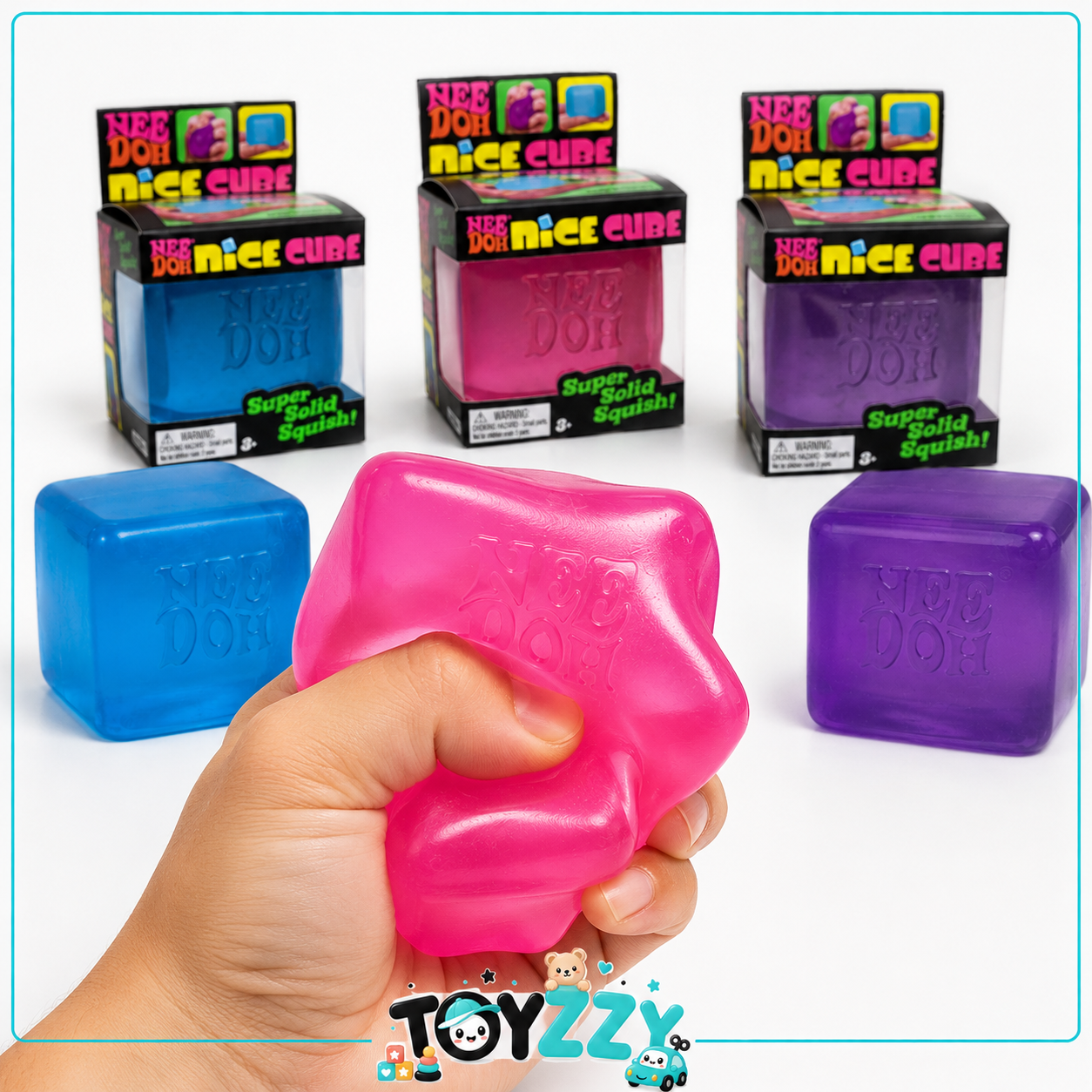 Pink NeeDoh Nice Cube squishy toy being squeezed by hand